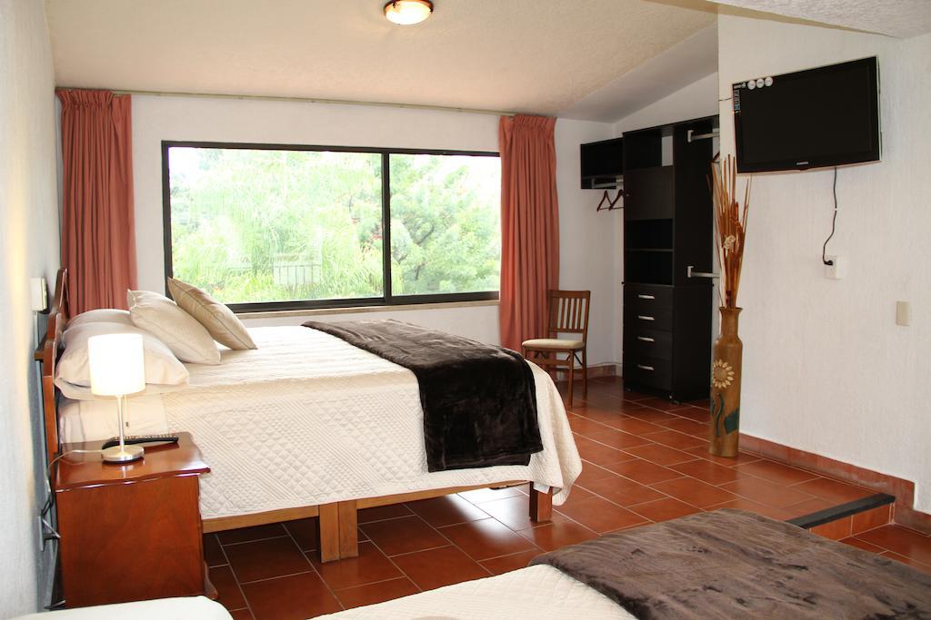 Hotel Quinta Del Sol Тепостлан Номер фото
